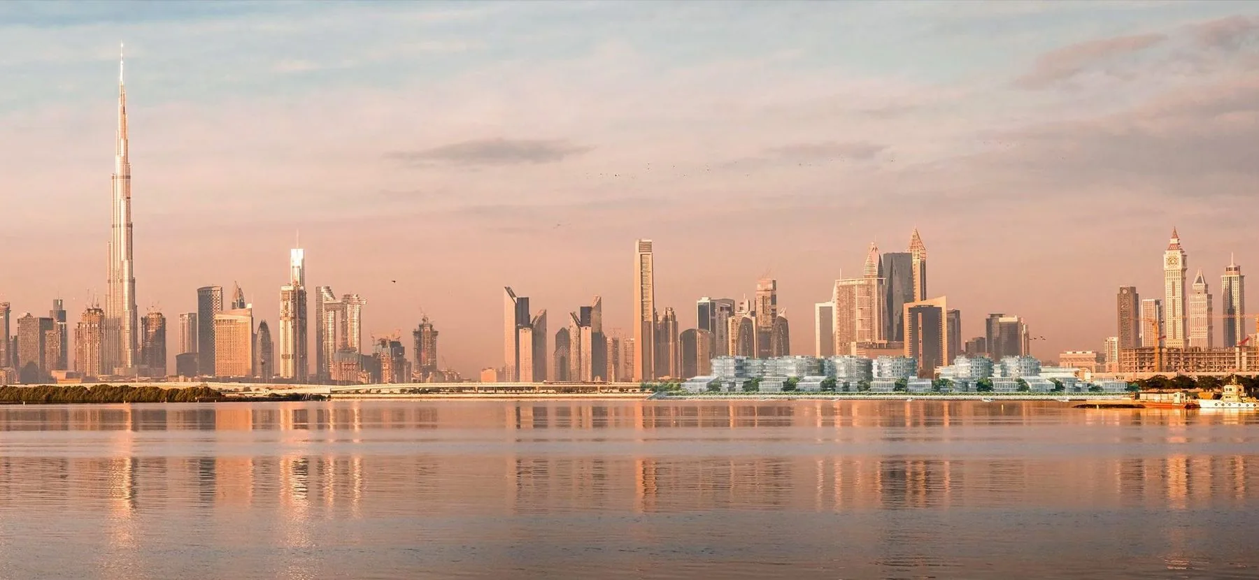 Dubai skyline reflected on Dubai Creek, with the Ritz-Carlton Residences on the 550m waterfront